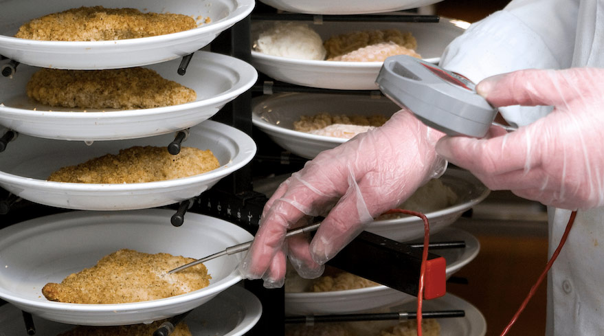 Chef doing food safety checks as part of the food safety management system.