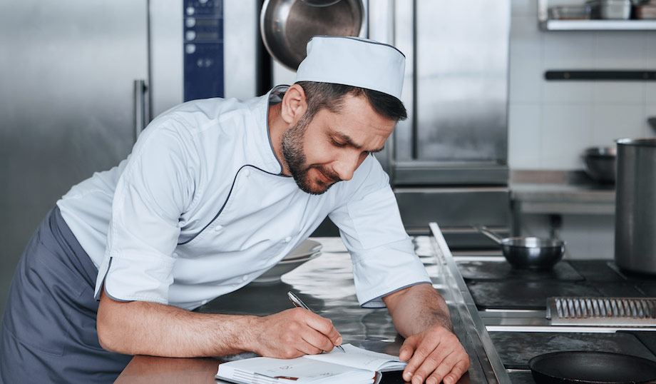 Chef preparing his food safety management system.